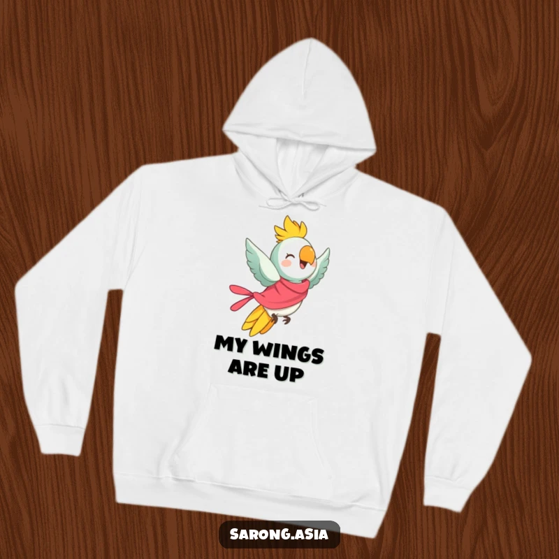 Funny hoodie featuring a cheerful parrot in a bright sarong, taking flight, offering warmth and a humorous, adventurous feel.